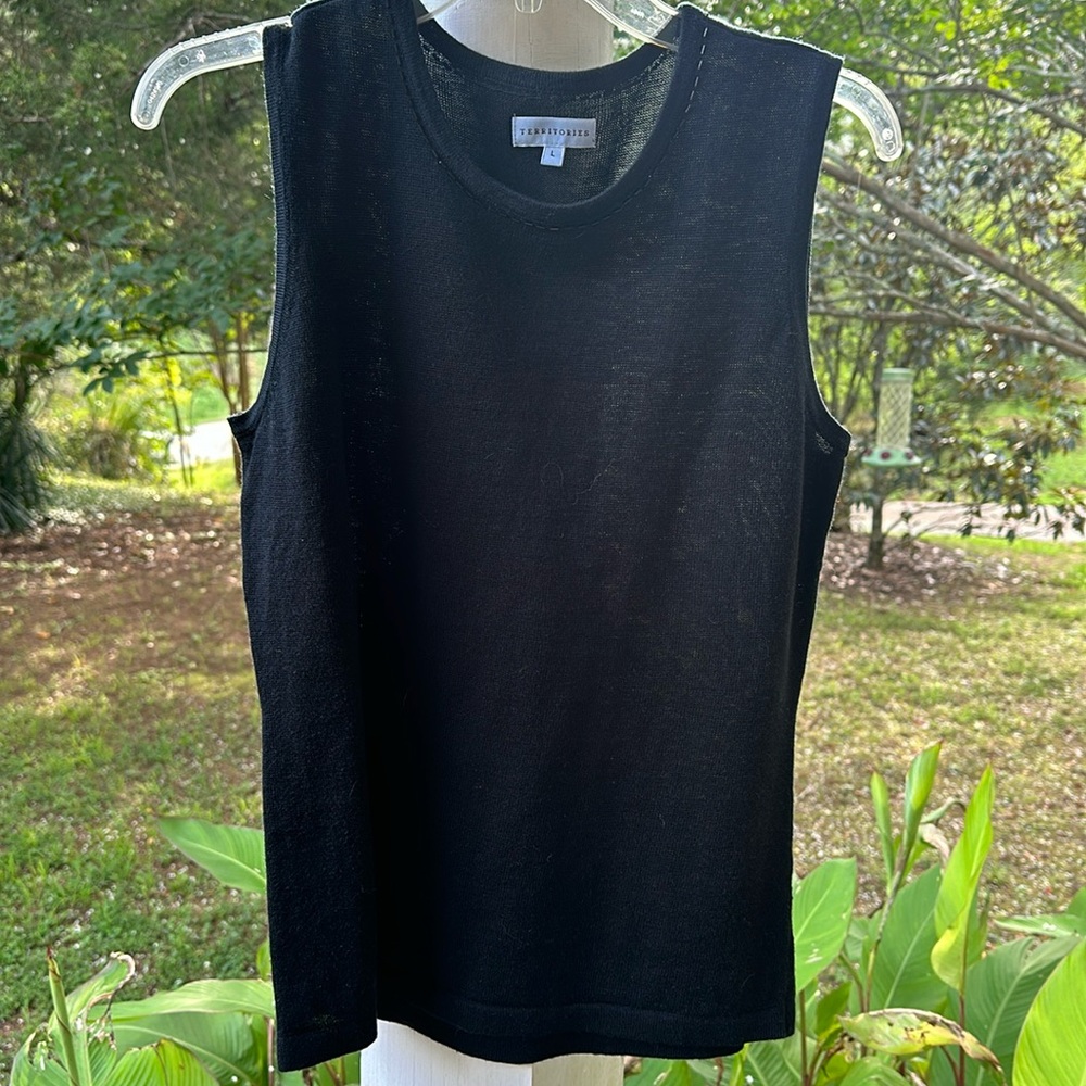 Size large black sleeveless sweater with beaded neck. Perfect for layering